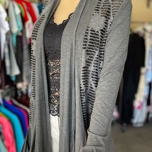 Carine grey and black light sweater.